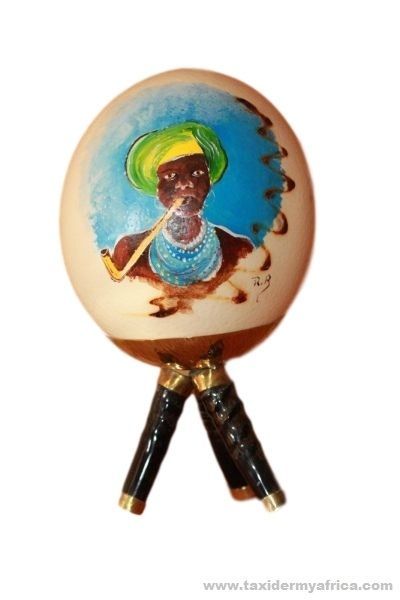 Painted ostrich egg with horn base